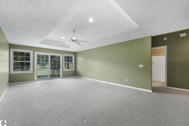 Enjoy low-maintenance living with beautiful golf course views in on Crown Golf Course in Michigan - for sale on GolfHomes.com, golf home, golf lot