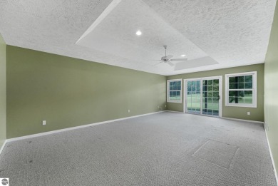 Enjoy low-maintenance living with beautiful golf course views in on Crown Golf Course in Michigan - for sale on GolfHomes.com, golf home, golf lot