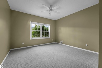 Enjoy low-maintenance living with beautiful golf course views in on Crown Golf Course in Michigan - for sale on GolfHomes.com, golf home, golf lot