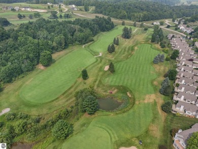 Enjoy low-maintenance living with beautiful golf course views in on Crown Golf Course in Michigan - for sale on GolfHomes.com, golf home, golf lot