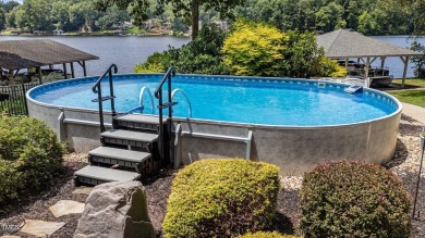 Discover exceptional Waterfront living in this stunning on River Golf and County Club at Lake Royale in North Carolina - for sale on GolfHomes.com, golf home, golf lot