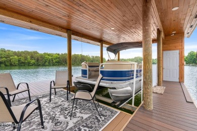 This Luxury Upscale Custom Lakefront Log  Stone Home invites you on Tellico Village -The Links At Kahite Golf Course in Tennessee - for sale on GolfHomes.com, golf home, golf lot