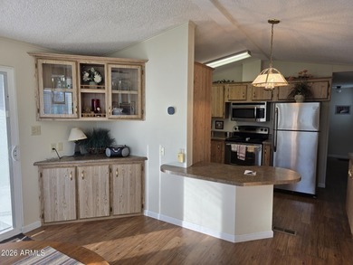 This rare 2bedroom, 2bathroom home offers a spacious living room on Great Eagle Golf Club in Arizona - for sale on GolfHomes.com, golf home, golf lot