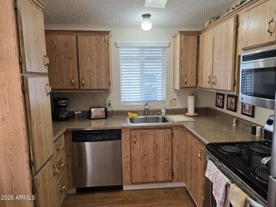This rare 2bedroom, 2bathroom home offers a spacious living room on Great Eagle Golf Club in Arizona - for sale on GolfHomes.com, golf home, golf lot