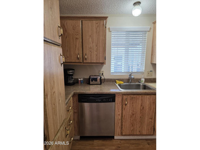 This rare 2bedroom, 2bathroom home offers a spacious living room on Great Eagle Golf Club in Arizona - for sale on GolfHomes.com, golf home, golf lot