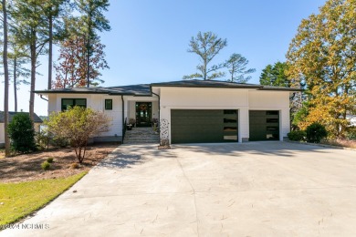 Enjoy luxurious lake front living at its finest in this on Beacon Ridge Golf and Country Club in North Carolina - for sale on GolfHomes.com, golf home, golf lot