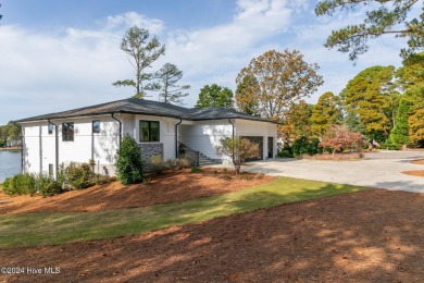 Enjoy luxurious lake front living at its finest in this on Beacon Ridge Golf and Country Club in North Carolina - for sale on GolfHomes.com, golf home, golf lot