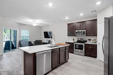 This perfectly maintained, low-maintenance townhome is ready for on Golf Club At South Hampton in Florida - for sale on GolfHomes.com, golf home, golf lot