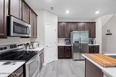 This perfectly maintained, low-maintenance townhome is ready for on Golf Club At South Hampton in Florida - for sale on GolfHomes.com, golf home, golf lot