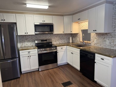 THIS LOVELY, 2/2 MANUFACTURED HOME IS ON LEASED LAND.  MONTHLY on Pine Lakes Country Club in Florida - for sale on GolfHomes.com, golf home, golf lot