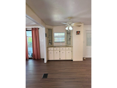 THIS LOVELY, 2/2 MANUFACTURED HOME IS ON LEASED LAND.  MONTHLY on Pine Lakes Country Club in Florida - for sale on GolfHomes.com, golf home, golf lot