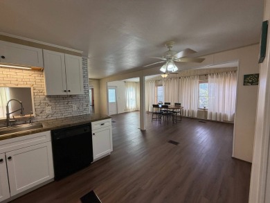 THIS LOVELY, 2/2 MANUFACTURED HOME IS ON LEASED LAND.  MONTHLY on Pine Lakes Country Club in Florida - for sale on GolfHomes.com, golf home, golf lot