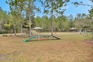 This perfectly maintained, low-maintenance townhome is ready for on Golf Club At South Hampton in Florida - for sale on GolfHomes.com, golf home, golf lot