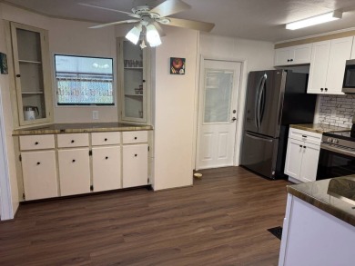 THIS LOVELY, 2/2 MANUFACTURED HOME IS ON LEASED LAND.  MONTHLY on Pine Lakes Country Club in Florida - for sale on GolfHomes.com, golf home, golf lot