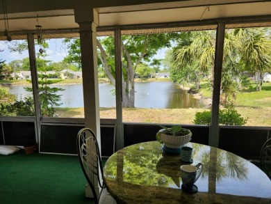 Experience peaceful pond-side living with stunning sunset views on Beacon Woods Golf Club in Florida - for sale on GolfHomes.com, golf home, golf lot