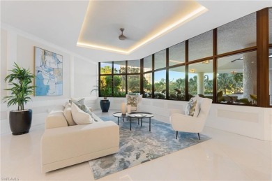 Experience the epitome of modern coastal luxury in this stunning on Club at Pelican Bay Golf Course in Florida - for sale on GolfHomes.com, golf home, golf lot