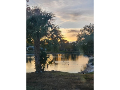 Experience peaceful pond-side living with stunning sunset views on Beacon Woods Golf Club in Florida - for sale on GolfHomes.com, golf home, golf lot