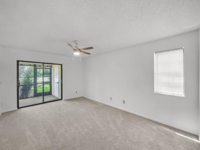Rarely Available First Floor End Unit with views of the 7th hole on The Golf Club of Jupiter in Florida - for sale on GolfHomes.com, golf home, golf lot