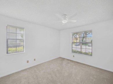 Rarely Available First Floor End Unit with views of the 7th hole on The Golf Club of Jupiter in Florida - for sale on GolfHomes.com, golf home, golf lot