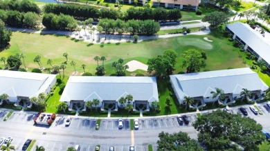 Rarely Available First Floor End Unit with views of the 7th hole on The Golf Club of Jupiter in Florida - for sale on GolfHomes.com, golf home, golf lot