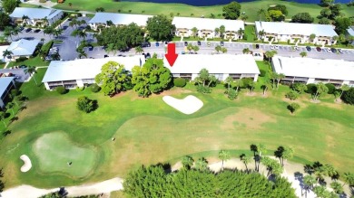 Rarely Available First Floor End Unit with views of the 7th hole on The Golf Club of Jupiter in Florida - for sale on GolfHomes.com, golf home, golf lot