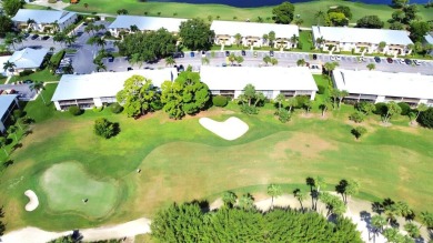 Rarely Available First Floor End Unit with views of the 7th hole on The Golf Club of Jupiter in Florida - for sale on GolfHomes.com, golf home, golf lot