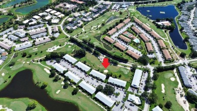 Rarely Available First Floor End Unit with views of the 7th hole on The Golf Club of Jupiter in Florida - for sale on GolfHomes.com, golf home, golf lot
