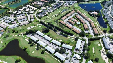 Rarely Available First Floor End Unit with views of the 7th hole on The Golf Club of Jupiter in Florida - for sale on GolfHomes.com, golf home, golf lot