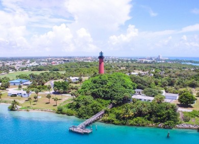Rarely Available First Floor End Unit with views of the 7th hole on The Golf Club of Jupiter in Florida - for sale on GolfHomes.com, golf home, golf lot