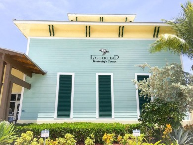 Rarely Available First Floor End Unit with views of the 7th hole on The Golf Club of Jupiter in Florida - for sale on GolfHomes.com, golf home, golf lot