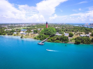 Rarely Available First Floor End Unit with views of the 7th hole on The Golf Club of Jupiter in Florida - for sale on GolfHomes.com, golf home, golf lot