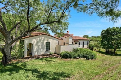 Discover this charming Hill Country Spanish-style Casita on Apple Rock Golf Course - Horseshoe Bay in Texas - for sale on GolfHomes.com, golf home, golf lot