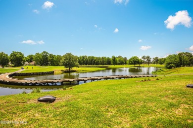 Wake up every day to serene, uninterrupted views of the pond and on Sea Trail Golf Resort in North Carolina - for sale on GolfHomes.com, golf home, golf lot