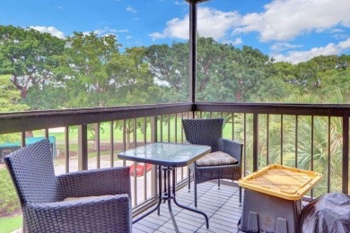 Enjoy tranquil golf course vistas from all angles and the on Boca West Golf and Country Club in Florida - for sale on GolfHomes.com, golf home, golf lot