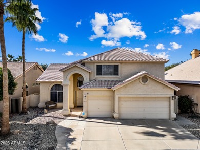 Stunning 4-bedroom, 3-bath home on the golf course in Ahwatukee on The Foothills Golf Club in Arizona - for sale on GolfHomes.com, golf home, golf lot