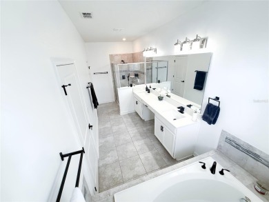 MANY UPGRADES!! Welcome to this exclusive gated community of on The Oasis Club at Champions Gate in Florida - for sale on GolfHomes.com, golf home, golf lot