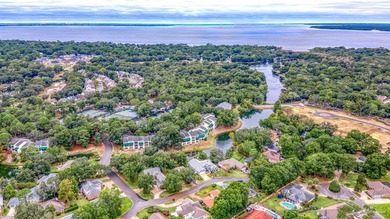 Where the tranquility of the water meets the refinement of on Fairway Oaks at Magnolia Golf Course in Florida - for sale on GolfHomes.com, golf home, golf lot