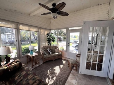 This stunning 2 bedroom, 2 bath home has been thoughtfully on Lake Henry Golf Club in Florida - for sale on GolfHomes.com, golf home, golf lot