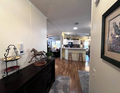 This stunning 2 bedroom, 2 bath home has been thoughtfully on Lake Henry Golf Club in Florida - for sale on GolfHomes.com, golf home, golf lot