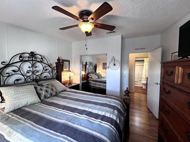 This stunning 2 bedroom, 2 bath home has been thoughtfully on Lake Henry Golf Club in Florida - for sale on GolfHomes.com, golf home, golf lot