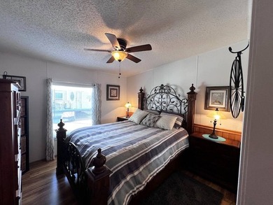 This stunning 2 bedroom, 2 bath home has been thoughtfully on Lake Henry Golf Club in Florida - for sale on GolfHomes.com, golf home, golf lot