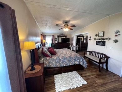 This stunning 2 bedroom, 2 bath home has been thoughtfully on Lake Henry Golf Club in Florida - for sale on GolfHomes.com, golf home, golf lot