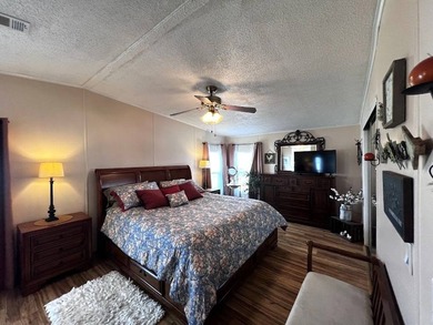 This stunning 2 bedroom, 2 bath home has been thoughtfully on Lake Henry Golf Club in Florida - for sale on GolfHomes.com, golf home, golf lot