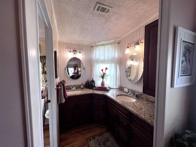 This stunning 2 bedroom, 2 bath home has been thoughtfully on Lake Henry Golf Club in Florida - for sale on GolfHomes.com, golf home, golf lot