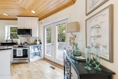 Discover your ideal canal front cottage right in time for on Founders Club At St. James Plantation in North Carolina - for sale on GolfHomes.com, golf home, golf lot