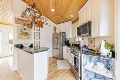 Discover your ideal canal front cottage right in time for on Founders Club At St. James Plantation in North Carolina - for sale on GolfHomes.com, golf home, golf lot