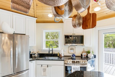 Discover your ideal canal front cottage right in time for on Founders Club At St. James Plantation in North Carolina - for sale on GolfHomes.com, golf home, golf lot