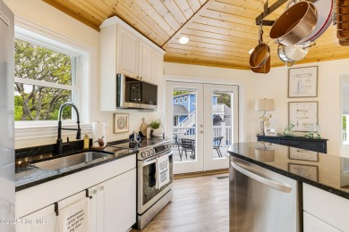 Discover your ideal canal front cottage right in time for on Founders Club At St. James Plantation in North Carolina - for sale on GolfHomes.com, golf home, golf lot