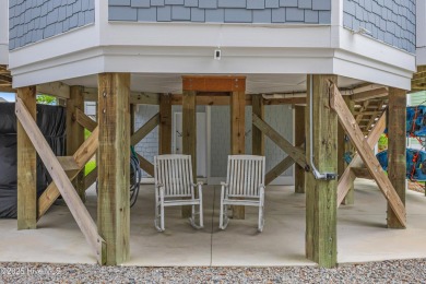 Discover your ideal canal front cottage right in time for on Founders Club At St. James Plantation in North Carolina - for sale on GolfHomes.com, golf home, golf lot
