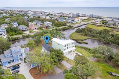 Discover your ideal canal front cottage right in time for on Founders Club At St. James Plantation in North Carolina - for sale on GolfHomes.com, golf home, golf lot